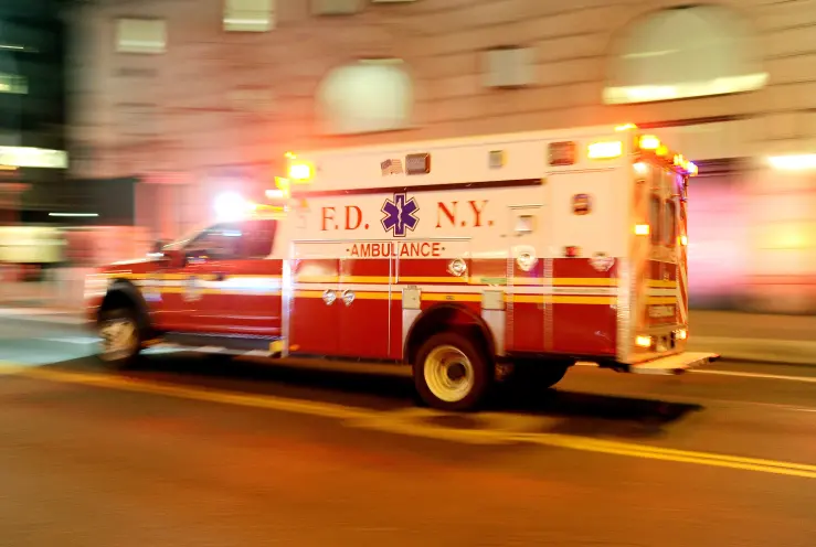 Emergency ambulance in motion for Emergency Green Wave Routing